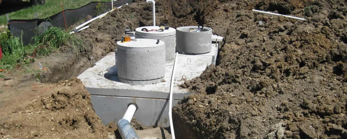 Septic system repair and installation site with tank access ports in Bradenton, FL