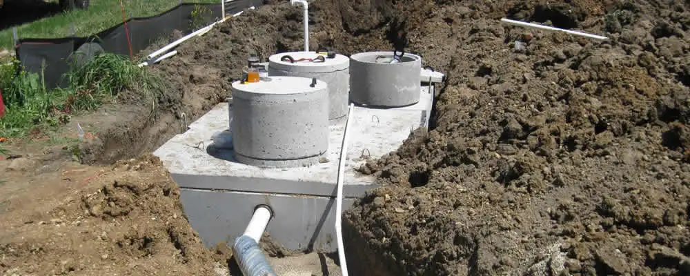 Septic system repair and installation site with tank access ports in Bradenton, FL