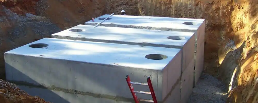 Septic tank installation site with a newly placed concrete tank in Bradenton, FL